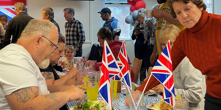 People sat at a table eating